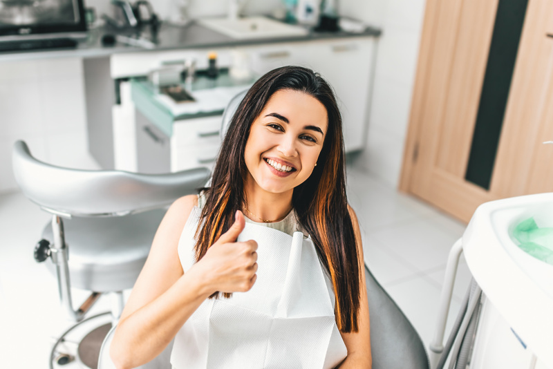 Happy Dental Patient in the Dental Clinic