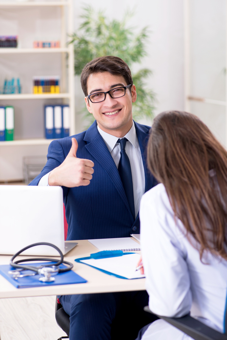 Man Signing Medical Insurance Contract